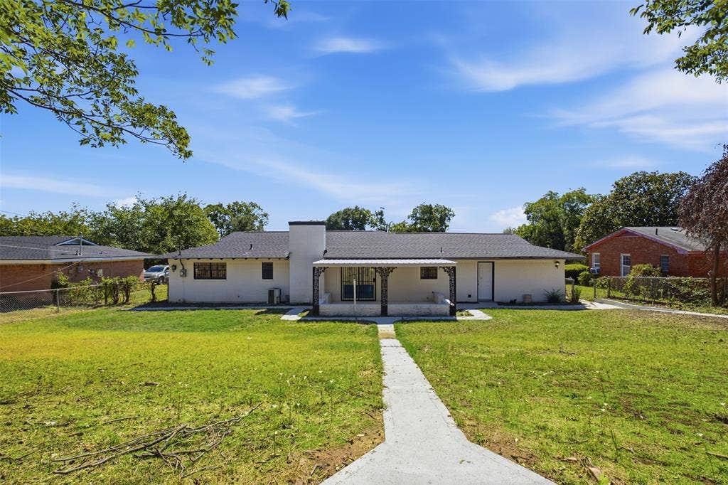 2313 Clearview Drive, Fort Worth, TX 76119 Single-story home featuring a covered front porch with decorative columns, white painted exterior, and a dark shingle roof