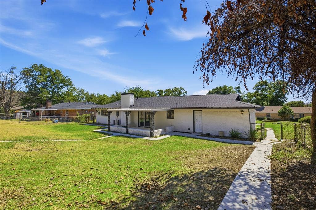 2313 Clearview Drive, Fort Worth, TX 76119 Exterior featuring white siding, a covered patio, a dark shingle roof, and a concrete pathway