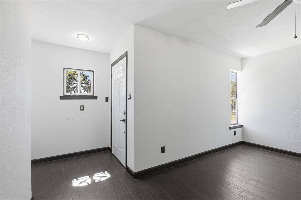 2313 Clearview Drive, Fort Worth, TX 76119 Dark wood-finish flooring with white walls and trim