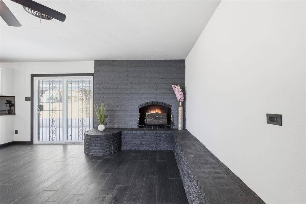 2313 Clearview Drive, Fort Worth, TX 76119 Dark wood-finish flooring with a modern ceiling fan