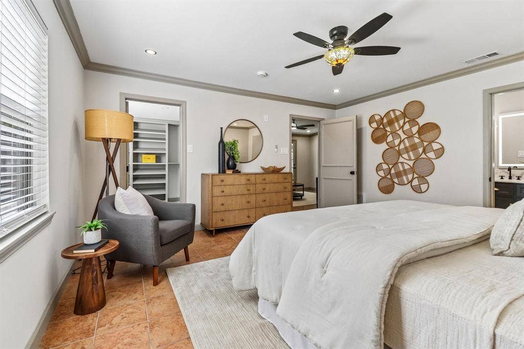 Recessed lighting, ceiling fan with decorative light fixture, built-in closet shelving, and tiled flooring