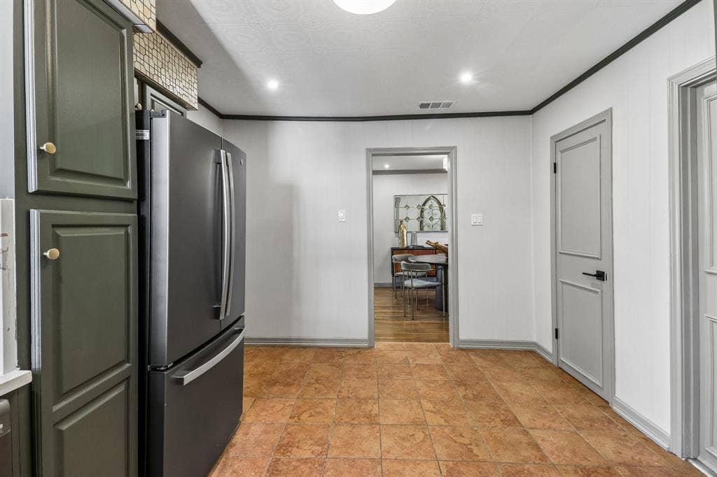 Tile flooring, recessed lighting, panel doors, and contrasting trim details