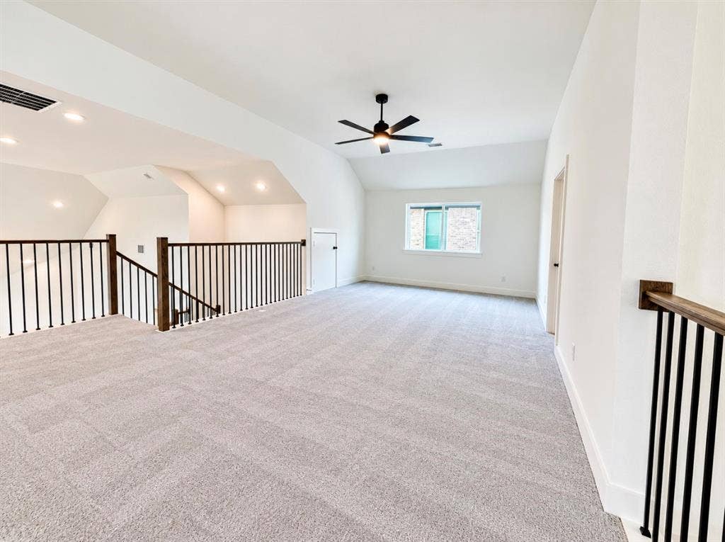 1129 Bradford Street, Celina, TX 75009 Spacious loft area featuring light-colored carpet, a ceiling fan, recessed lighting, and a window