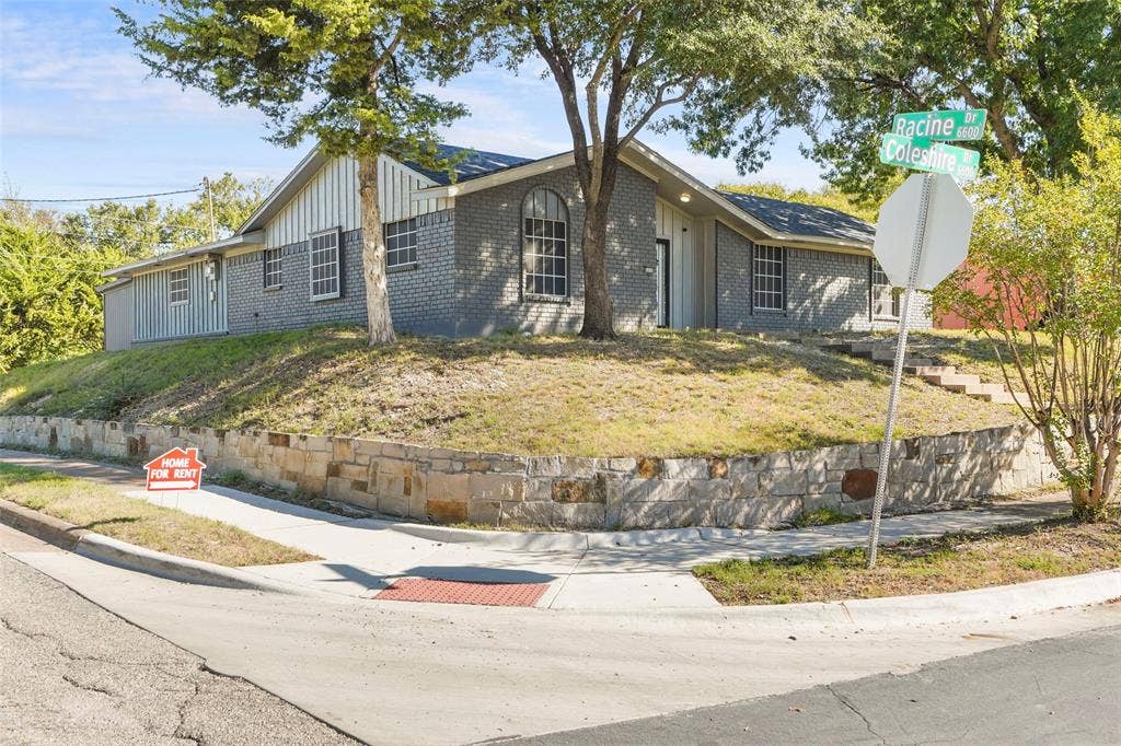 6606 Coleshire Drive, Dallas, TX 75232 Gray brick exterior with white siding accents