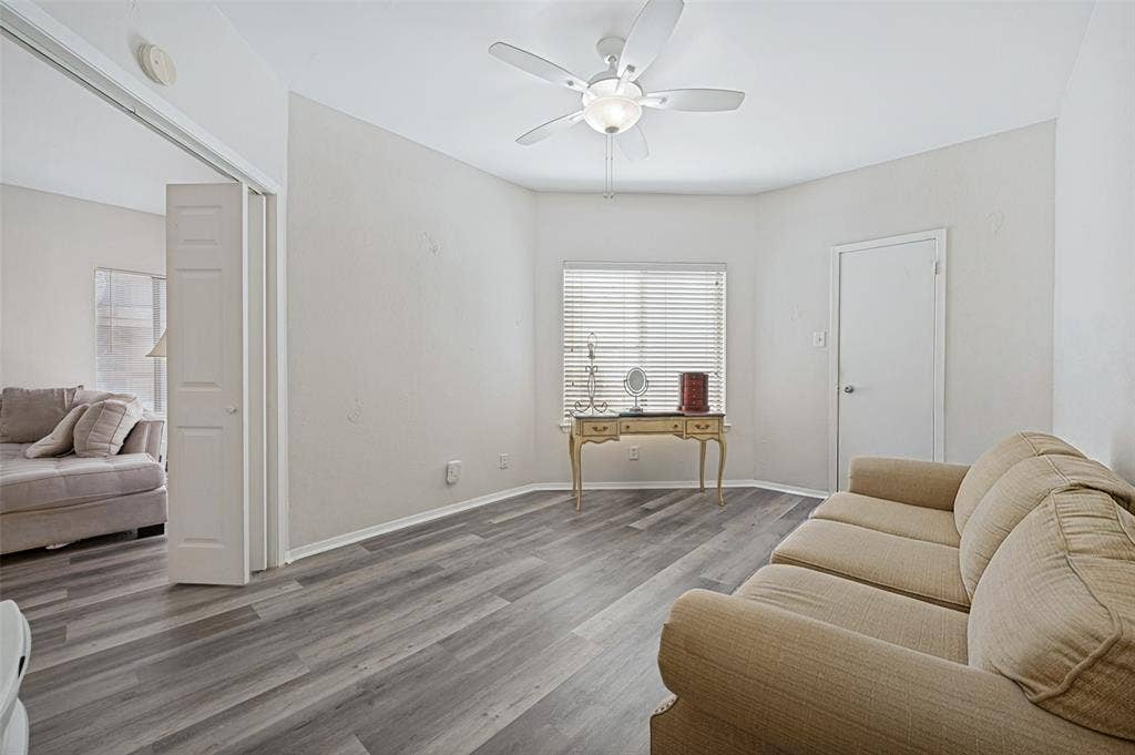 5550 Spring Valley Road, #C21, Dallas, TX 75254 Wood-finish flooring throughout, ceiling fan with integrated lighting, and white interior doors