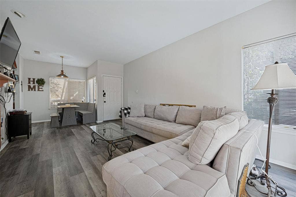 5550 Spring Valley Road, #C21, Dallas, TX 75254 Wood-finish flooring throughout, with a built-in dining nook featuring bench seating