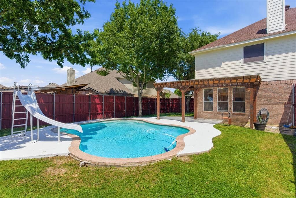 1416 Sunrise Lane, Sachse, TX 75048 Private backyard featuring a swimming pool, concrete decking, and a wood pergola