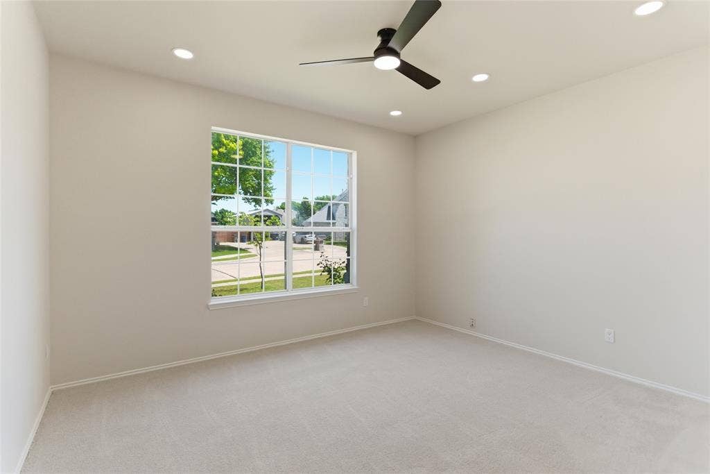 1416 Sunrise Lane, Sachse, TX 75048 Recessed lighting, ceiling fan, and large window with grid pattern