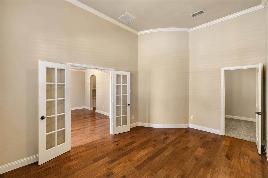 1049 Mesa Crest Drive, Fort Worth, TX 76052 Hardwood-finish flooring, crown molding, French doors with glass panels, high ceilings. HUGE walk in closet, could also be used as 5th bedroom.