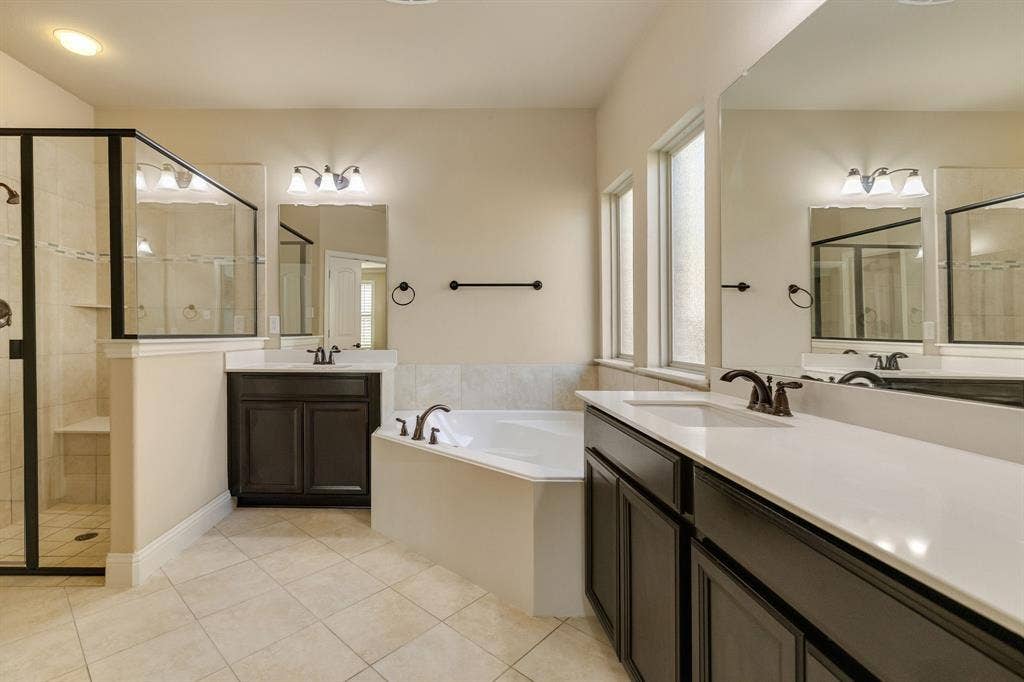 1049 Mesa Crest Drive, Fort Worth, TX 76052 Dual vanities with undermount sinks and dark wood-finish cabinetry
