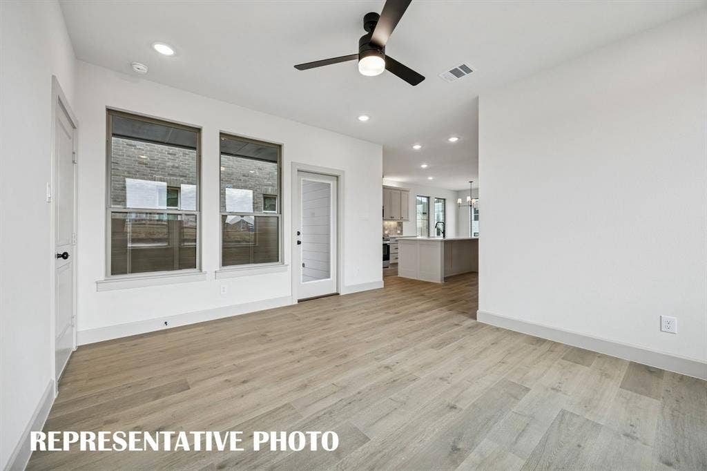 3729 Homer Court, McKinney, TX 75071 Spacious and inviting, this family room offers a wonderful space for family gatherings. REPRESENTATIVE PHOTO