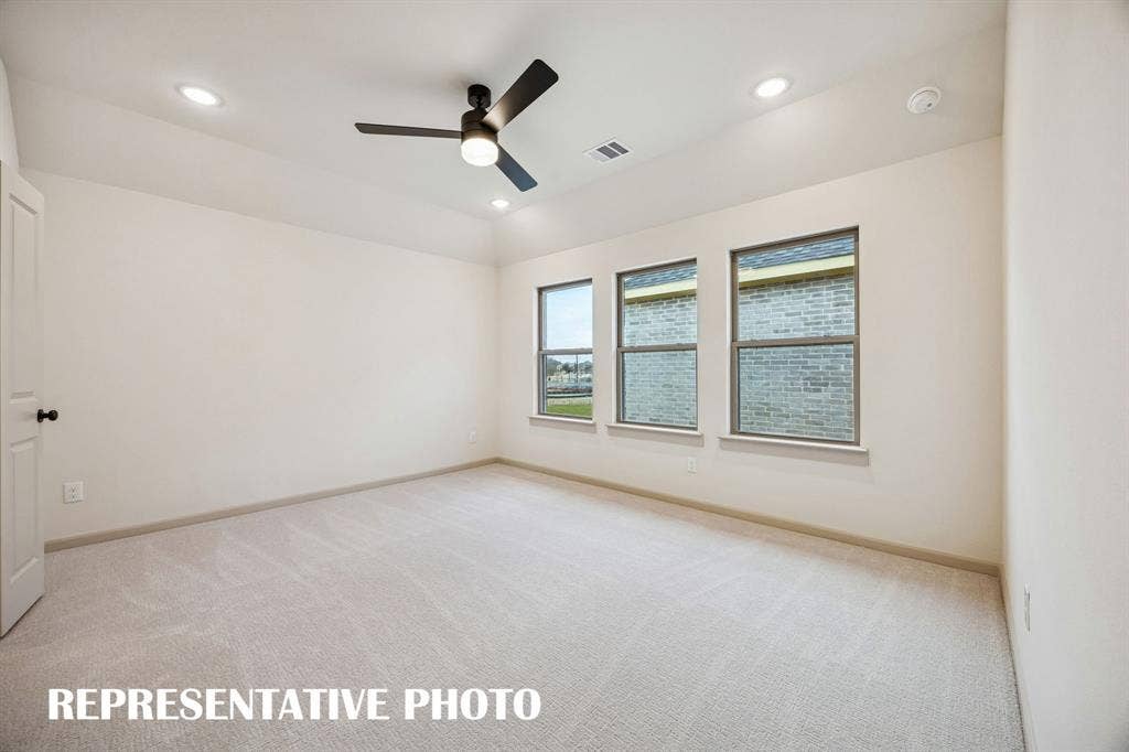 3729 Homer Court, McKinney, TX 75071 With high ceilings, plush carpeting and a wall of windows, this owner's suit is the perfect place for rest and relaxation. REPRESENTATIVE PHOTO