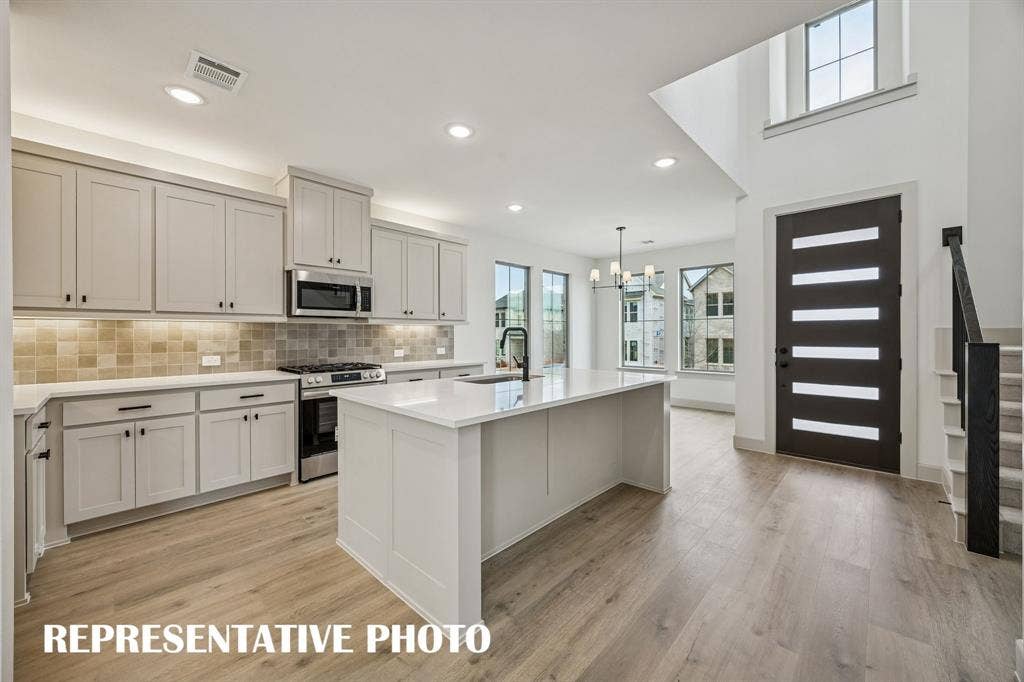 3729 Homer Court, McKinney, TX 75071 Open and light filled, this dream kitchen is the perfect place to host family and friends. REPRESENTATIVE PHOTO