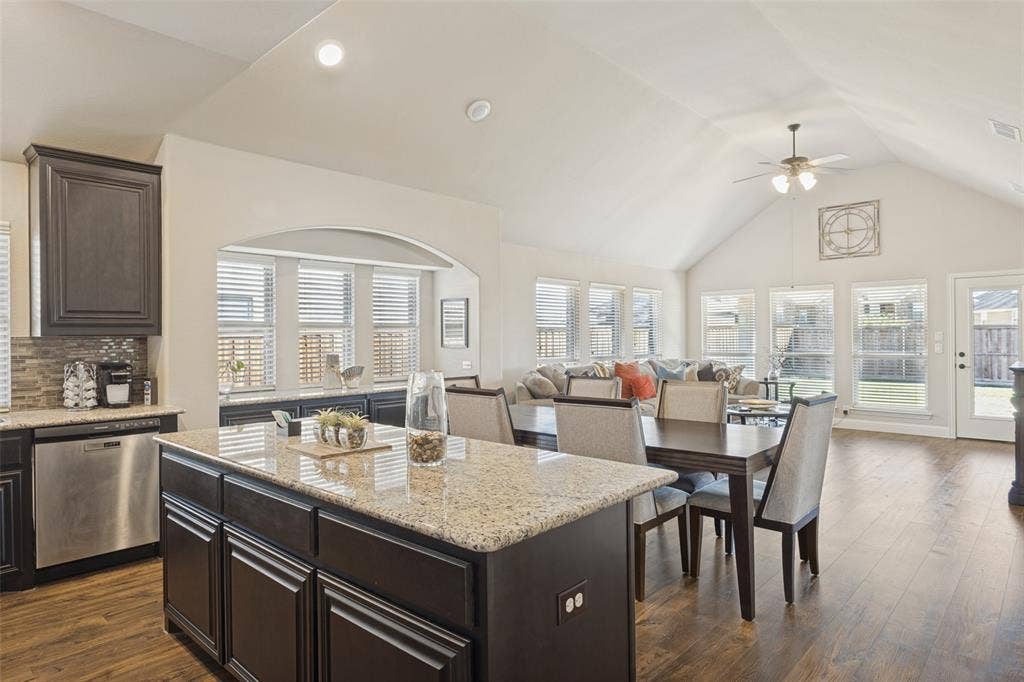 Another view of kitchen over looking dining area and living area.