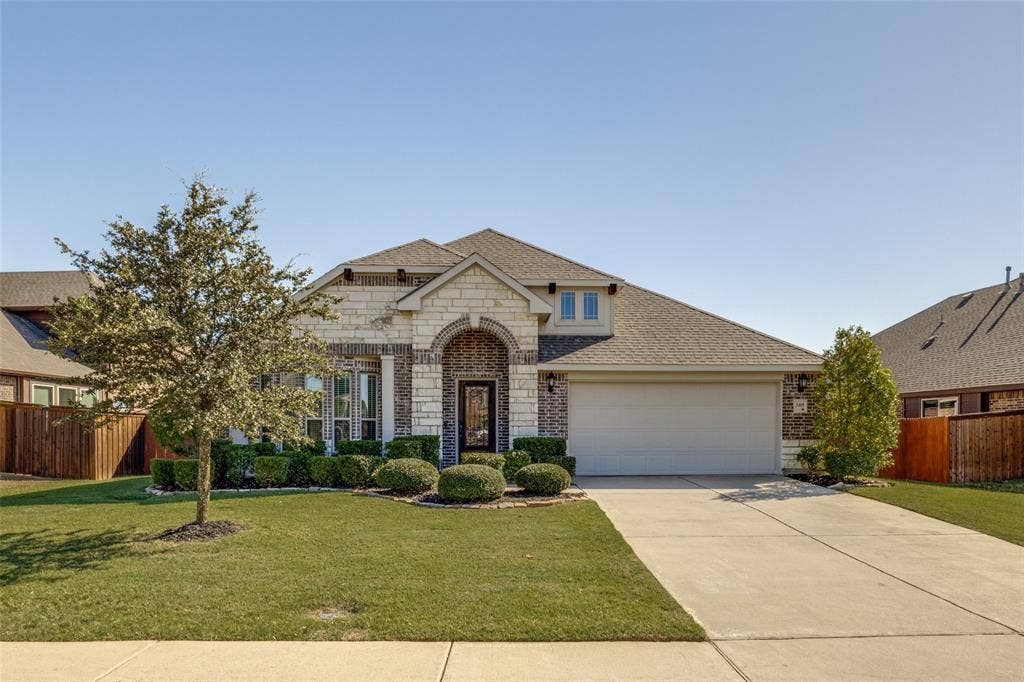 Beautiful Bloomfield Home with stone accent on front.