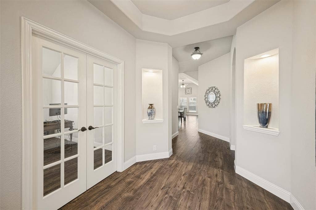 Another view of foyer adjacent to office with French Doors.  Insets are lighted.