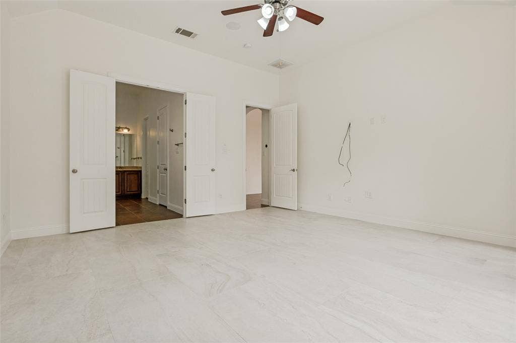 6734 Trailblazer Way, Dallas, TX 75236 Light-toned tile flooring, ceiling fan with light fixture, and double doors to an adjoining space