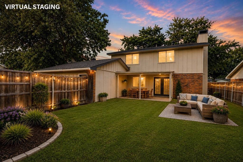 2018 Vail Drive, Garland, TX 75044 Expansive backyard with a manicured lawn, paved patio, and covered dining area