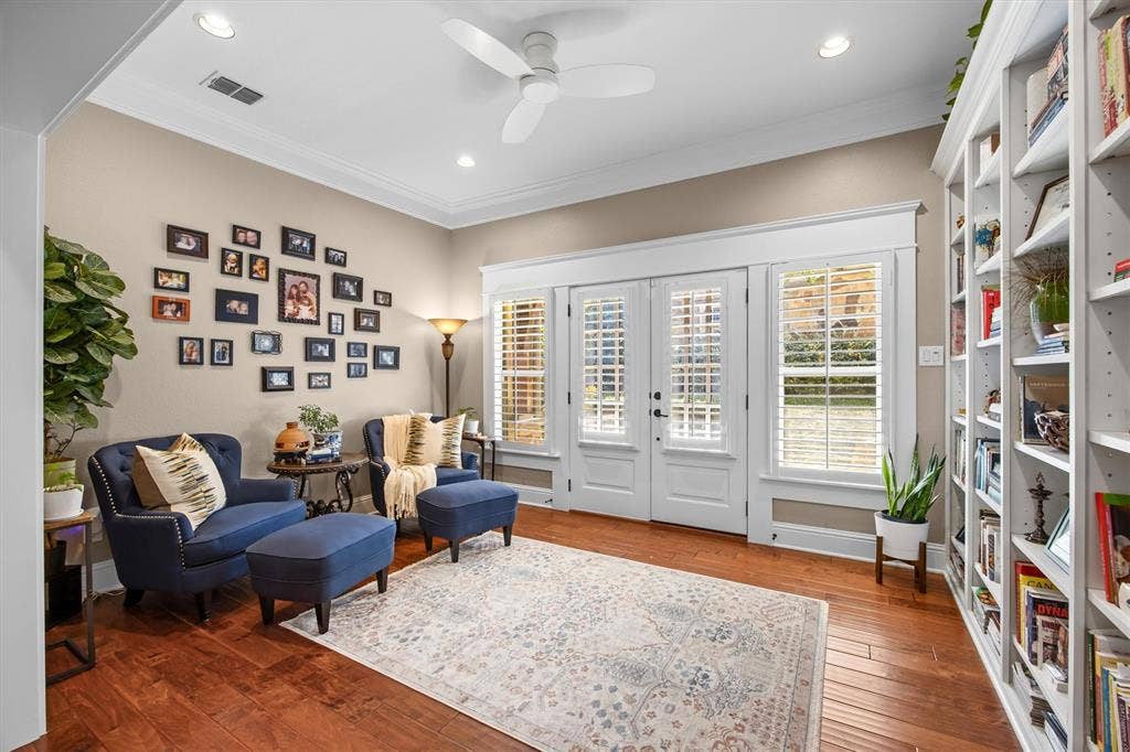 Sitting room with cheerful views of patio is the perfect place to enjoy morning coffee or after dinner relaxation.