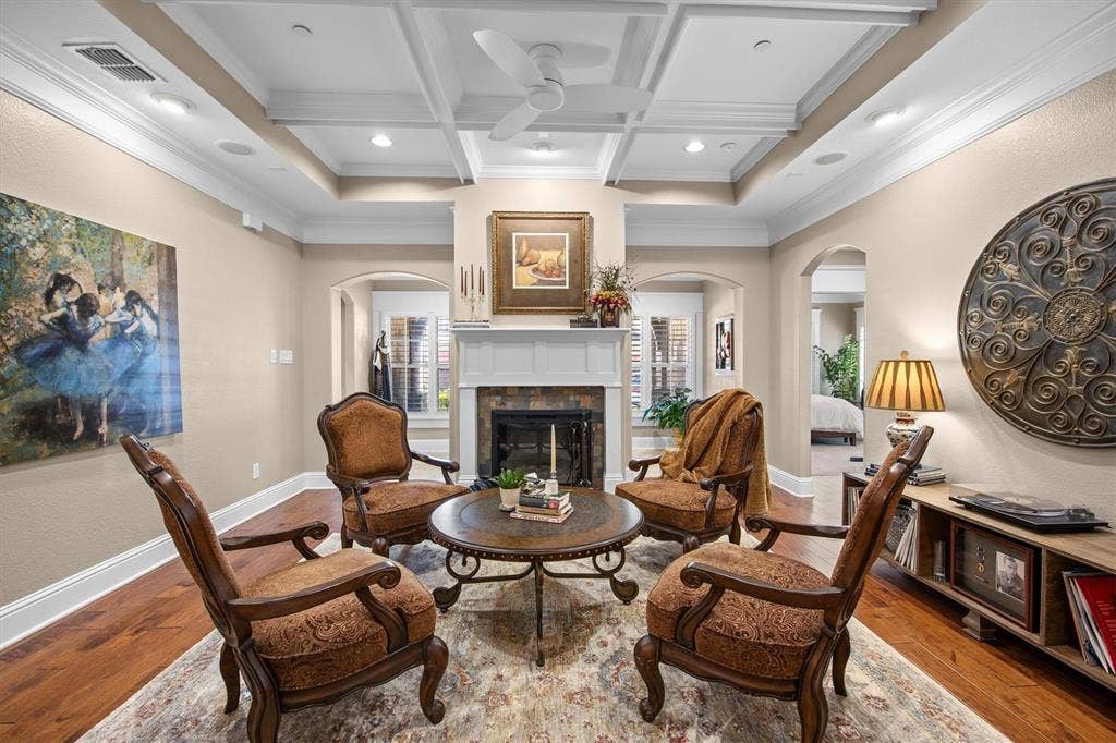 This gorgeous living room includes high end, redesigned, multi-function electric fireplace featuring dynamic flame options & ambient heating!