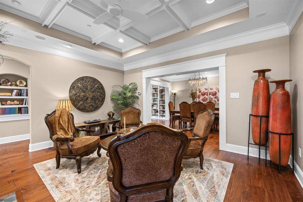 Hardwood flooring, coffered ceiling, recessed lighting, & crown molding!