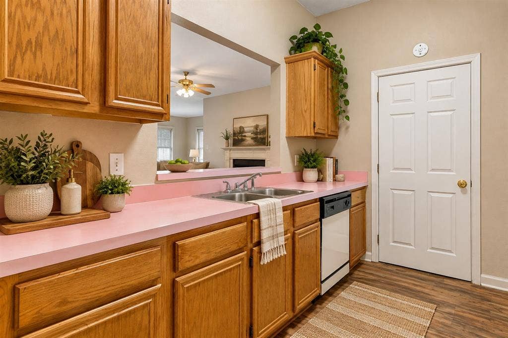 Kitchen is adjacent to full-sized laundry area and is open to living room.  Lots of room for all of your kitchen items in the cabinets and in the pantry!