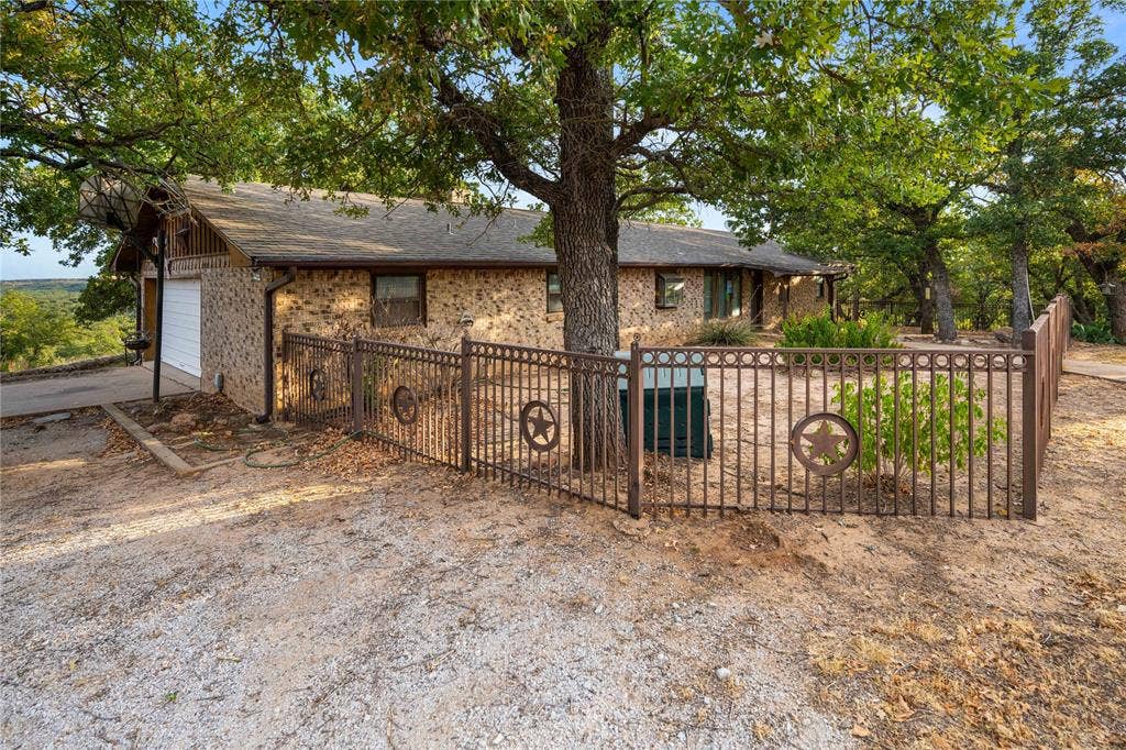 Western Front yard view with wrought Iron fence
