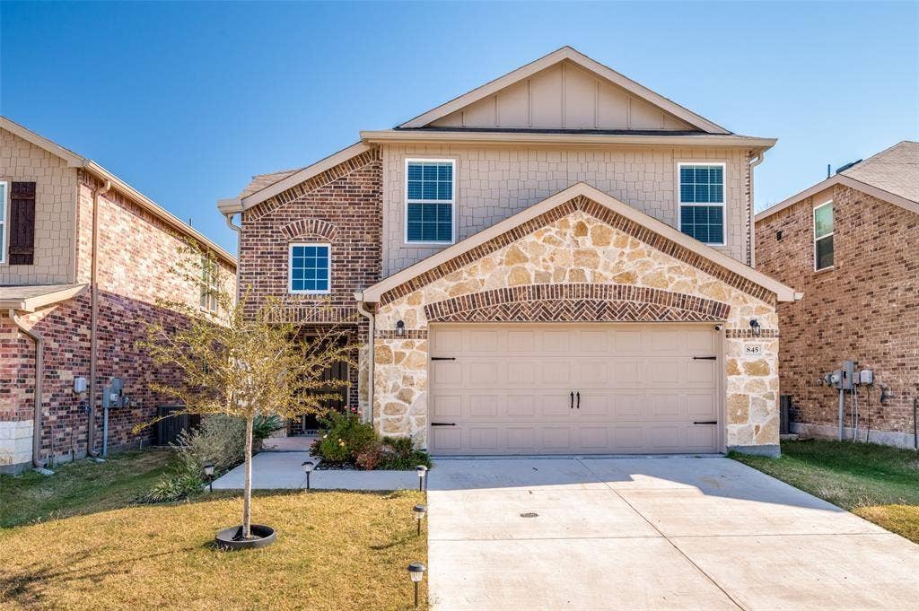 845 Poppy Cove Lane, Princeton, TX 75407 Two-story exterior featuring a mix of brick, stone, and siding
