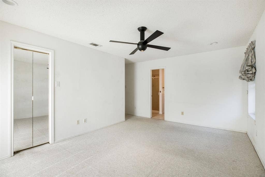 765 Eiffel Drive, Plano, TX 75023 White walls with light-toned carpeting