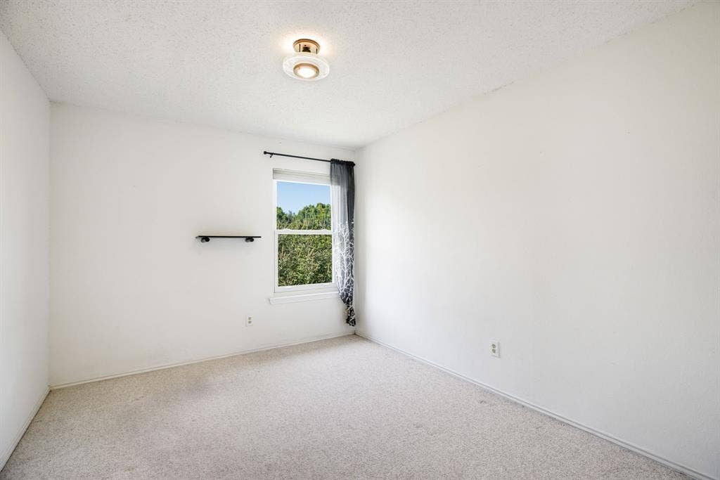 765 Eiffel Drive, Plano, TX 75023 Window with outdoor scenery, recessed lighting, wall-mounted shelf, light-toned carpeting