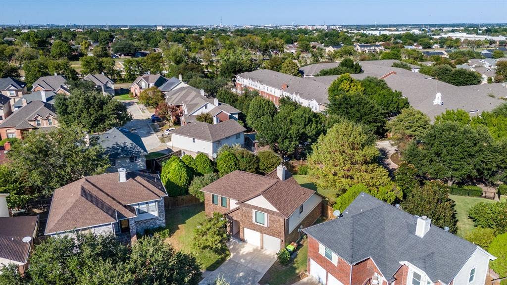 765 Eiffel Drive, Plano, TX 75023 Residential neighborhood with mature trees and a mix of roof styles