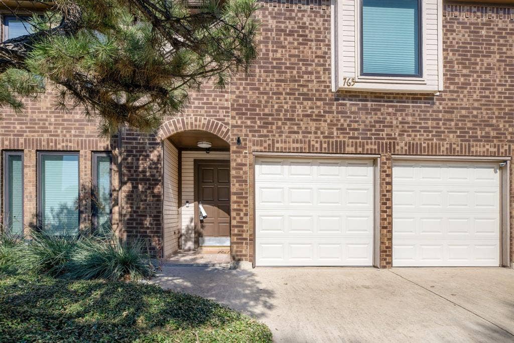 765 Eiffel Drive, Plano, TX 75023 Brick exterior with white trim
