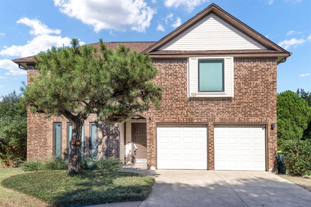 765 Eiffel Drive, Plano, TX 75023 Brick exterior with white siding accents