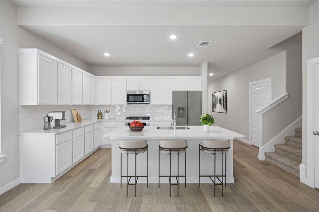 1341 Companero Street, Haslet, TX 76052 Kitchen in the Stanley II home plan – REPRESENTATIVE PHOTO