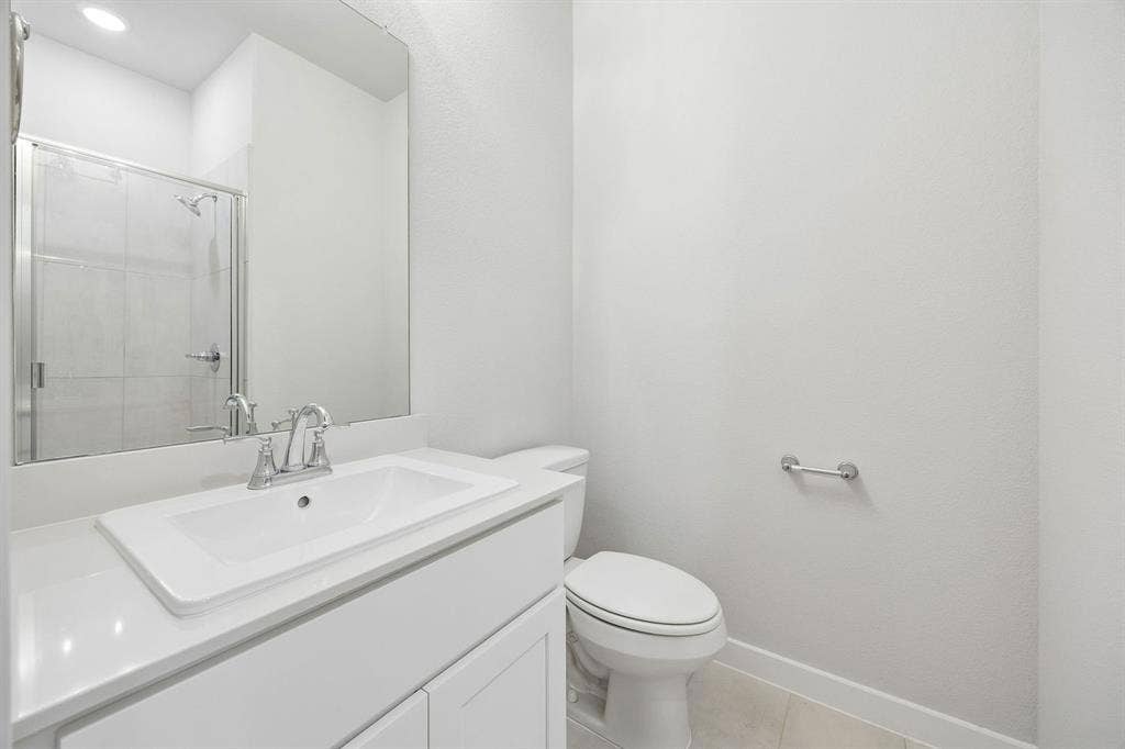 1345 Companero Street, Haslet, TX 76052 Bathroom in the Oscar home plan – REPRESENTATIVE PHOTO