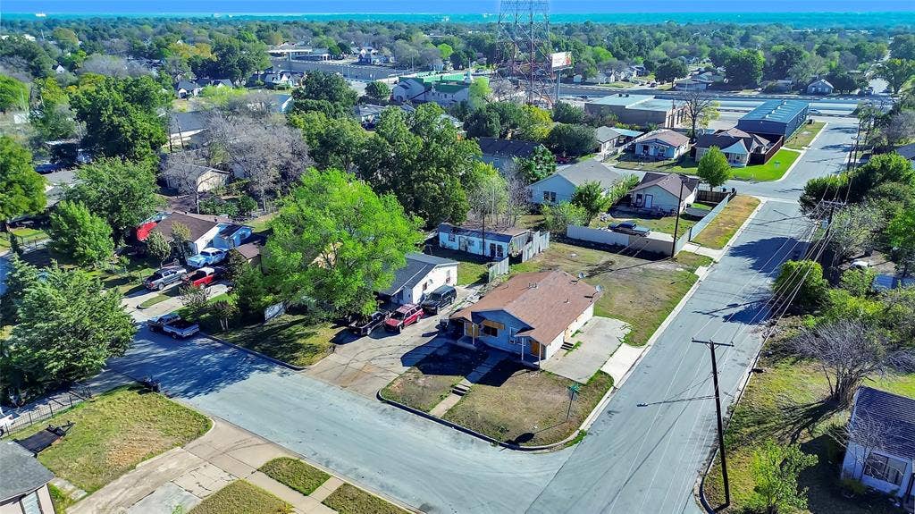 2745 S Jones Street, Fort Worth, TX 76104 Corner lot property featuring a residential structure and surrounding green spaces