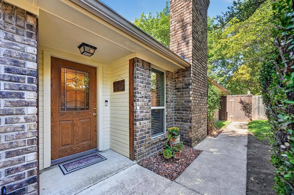 Private front entrance with a walk way that leads to the park like backyard,