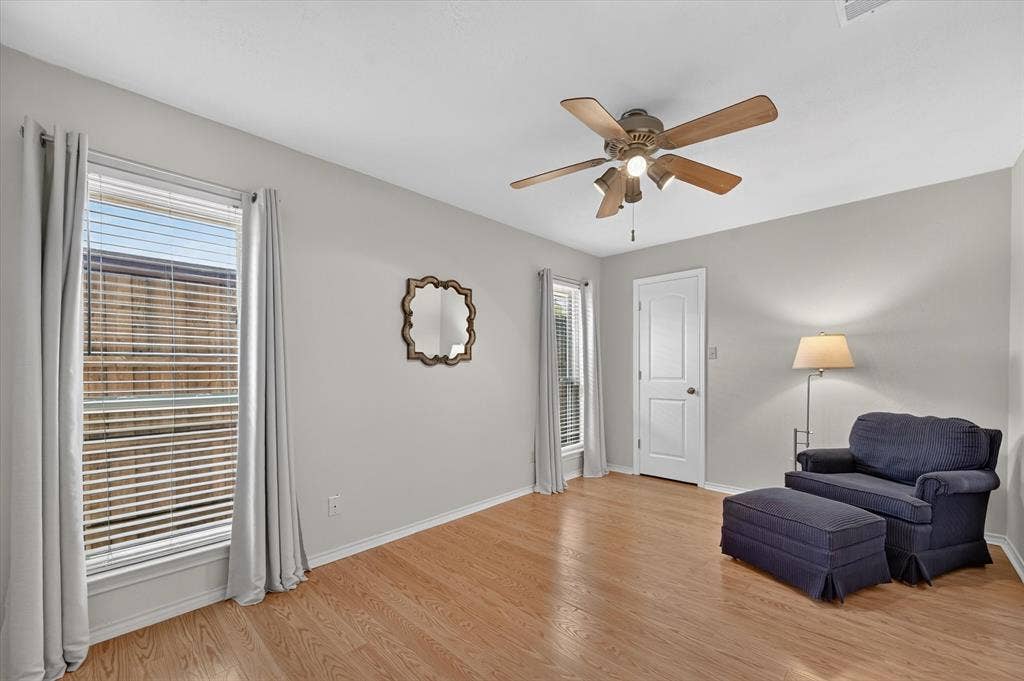 One of two downstairs secondary bedrooms. This one has hardwood floors and a walk in closet.