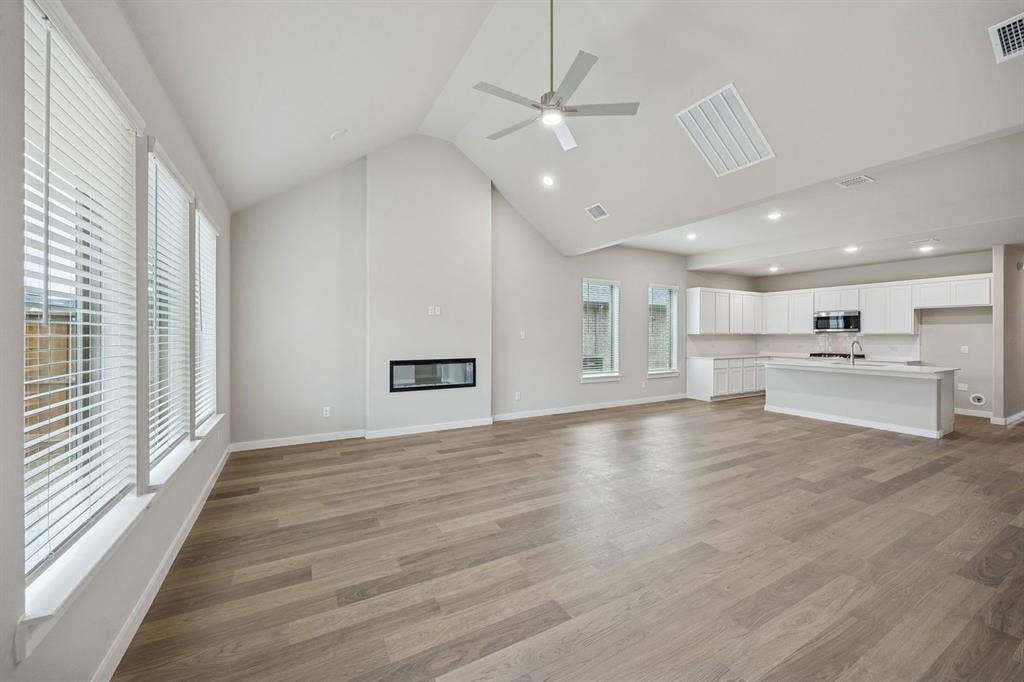 1321 Companero Street, Haslet, TX 76052 Living Room in the Stanley II home plan – REPRESENTATIVE PHOTO