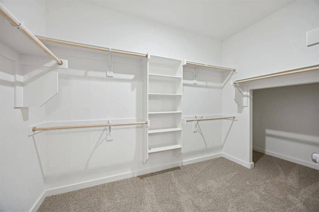 1321 Companero Street, Haslet, TX 76052 Primary Closet in the Stanley II home plan – REPRESENTATIVE PHOTO