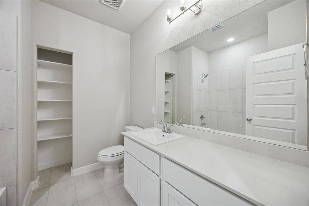 1321 Companero Street, Haslet, TX 76052 Bathroom in the Stanley II home plan – REPRESENTATIVE PHOTO