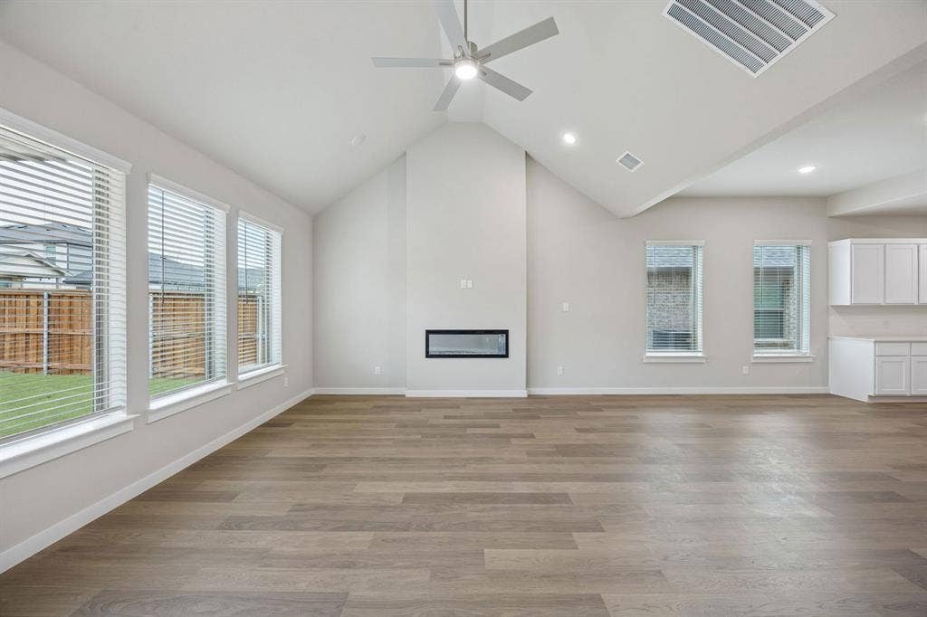 1321 Companero Street, Haslet, TX 76052 Living Room in the Stanley II home plan – REPRESENTATIVE PHOTO