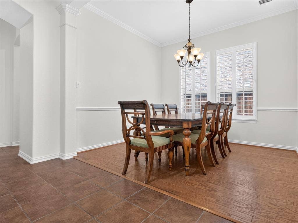 Recessed lighting, crown molding, chair rail, wood-finish flooring, and white plantation shutters