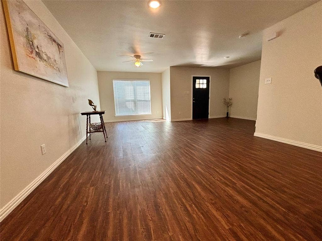 6215 Roby Drive, Arlington, TX 76001 Large open concept layout with large front window to allow natural lighting and to view the outdoors.