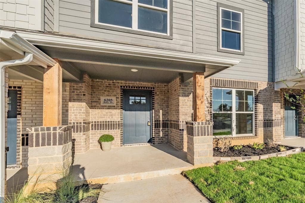 6215 Roby Drive, Arlington, TX 76001 Large porch entry, with lush landscaping. Lawn service and irrigation is included.