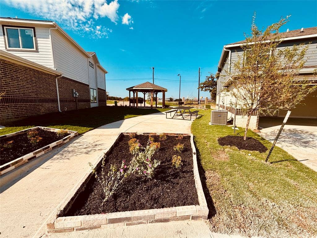 6215 Roby Drive, Arlington, TX 76001 View of yard with a gazebo and central air condition unit