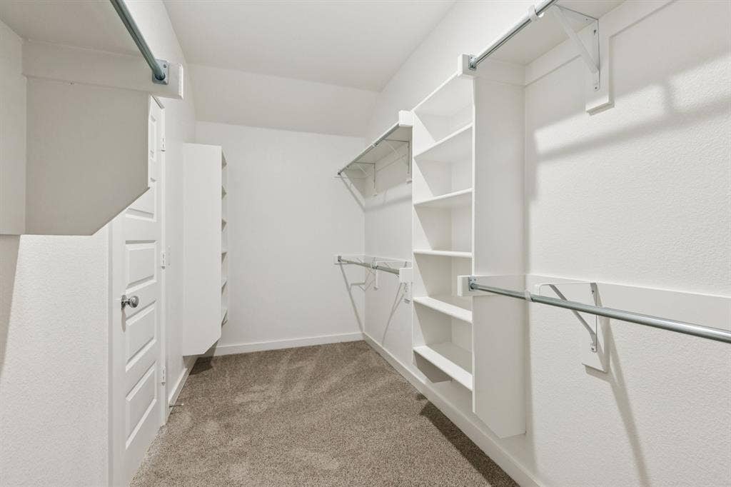 1309 Companero Street, Haslet, TX 76052 Primary Closet in the Heisman home plan – REPRESENTATIVE PHOTO