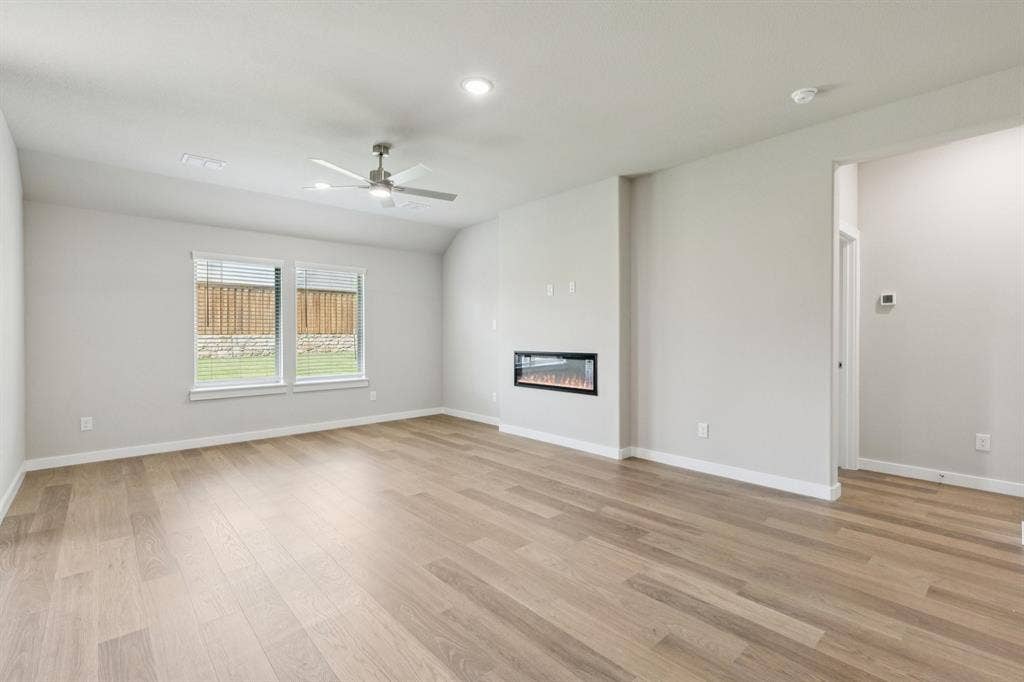 1309 Companero Street, Haslet, TX 76052 Living room in the Heisman home plan – REPRESENTATIVE PHOTO