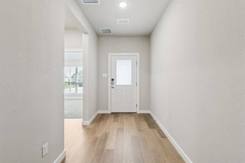 1309 Companero Street, Haslet, TX 76052 Entryway in the Heisman home plan – REPRESENTATIVE PHOTO