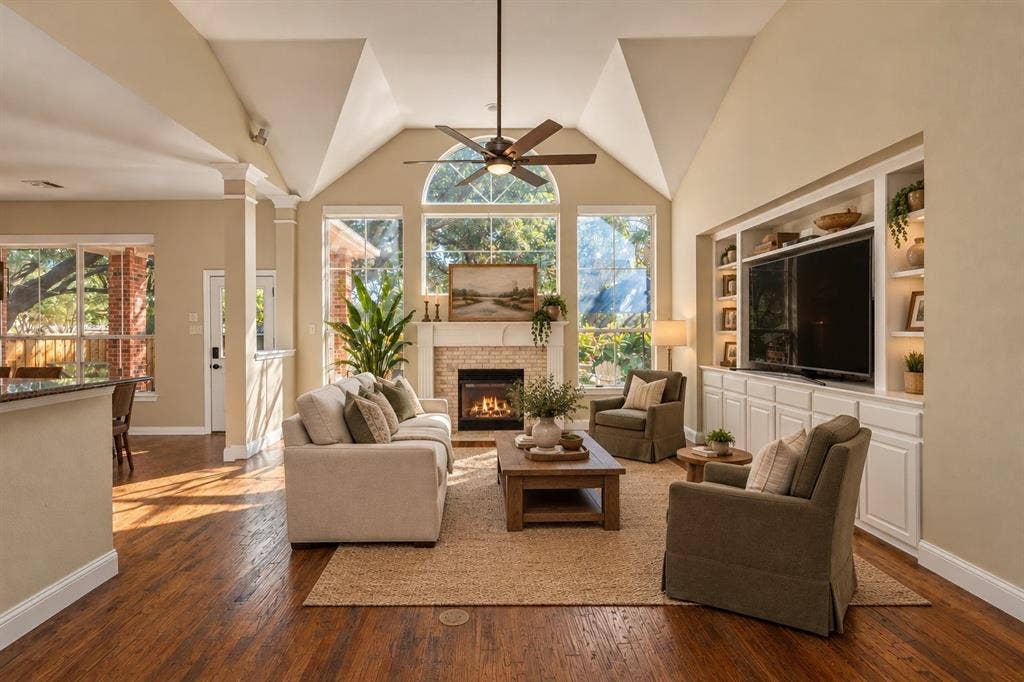 5705 Sandalwood Drive, McKinney, TX 75072 Virtually staged living room with a clean, bright, and inviting design that highlights the space’s open and comfortable feel.